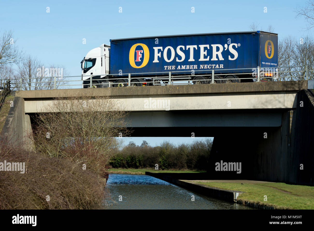 Foster`s lorry on the M40 motorway crossing the Oxford Canal, Banbury, Oxfordshire, UK Stock Photo